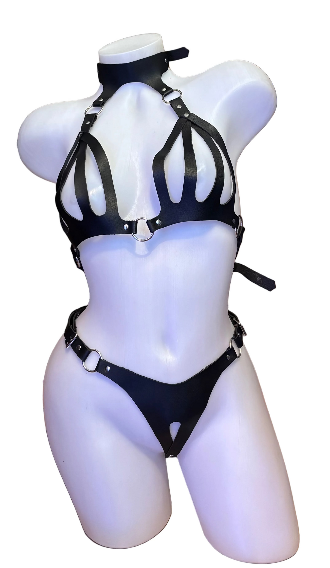 BS Faux Leather Harness Bikini lingerie with adjustable straps and metal hardware, shown on a model.