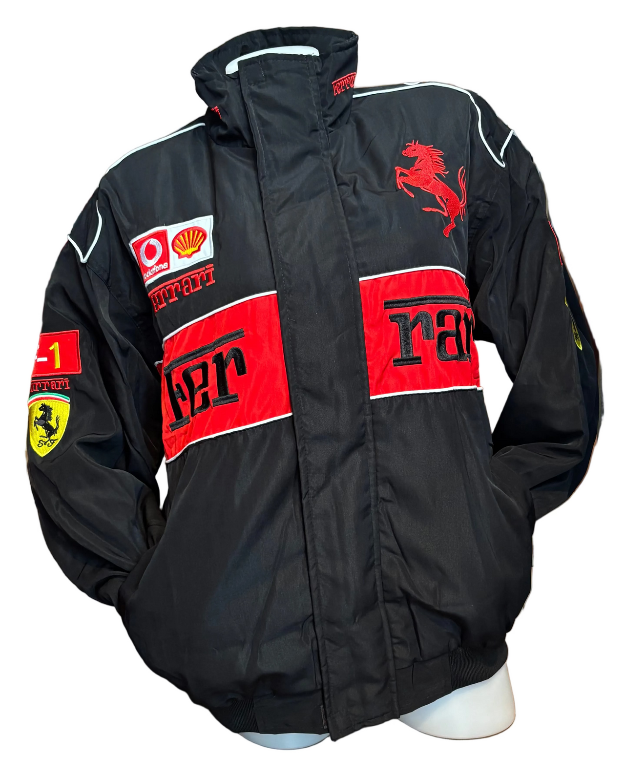Black Ferrari jacket from Model Express Vancouver, showcasing a stylish, fitted clothing piece with detailed Ferrari branding.