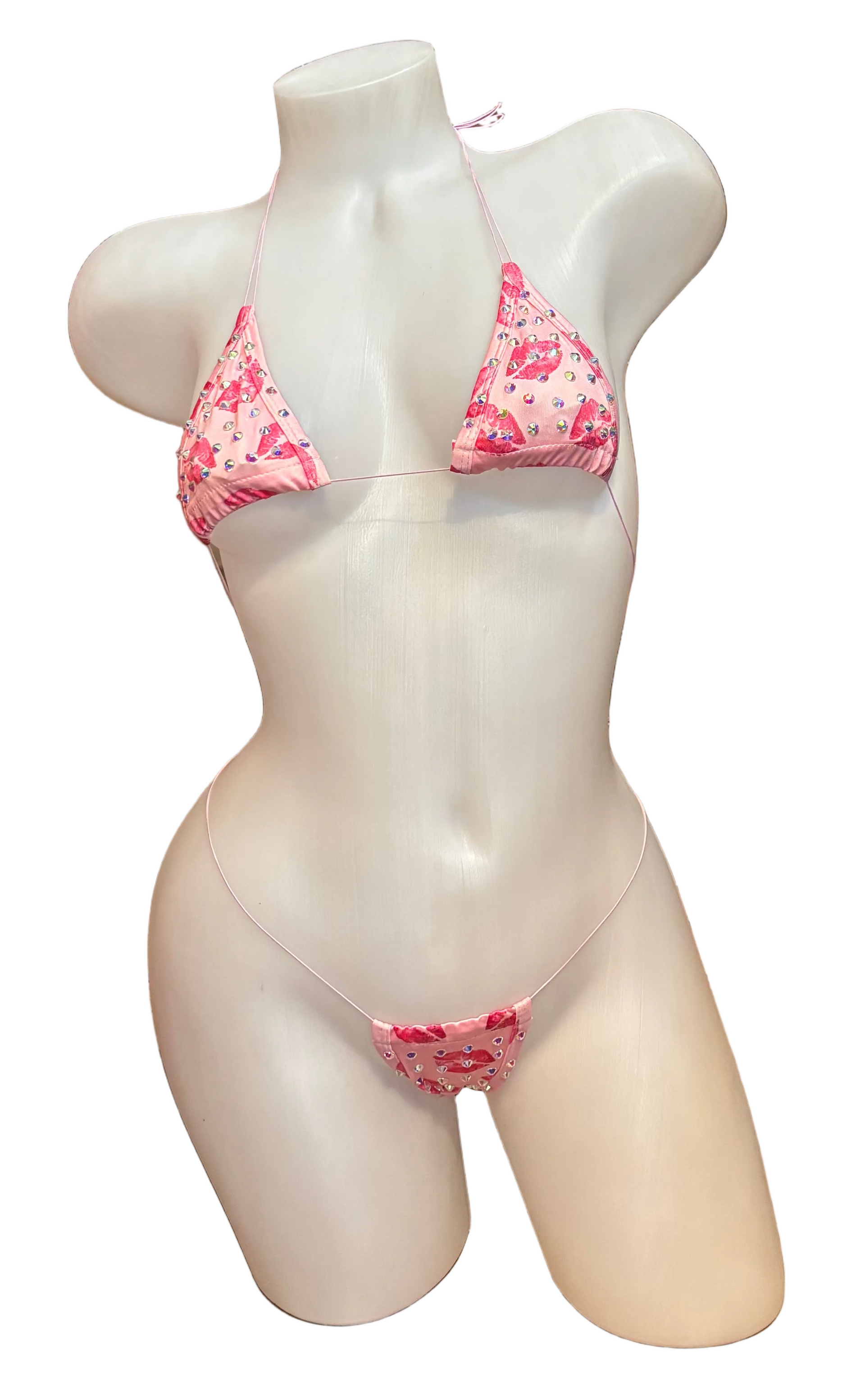 Pink rhinestone micro bikini from BPI featuring a glittering, revealing design perfect for beach or poolside wear.
